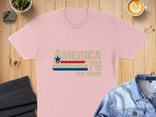 Load image into Gallery viewer, Pink t-shirt with "AMERICA '76 250 YEARS" text and distressed flag graphic.