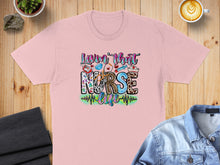 Load image into Gallery viewer, Pink t-shirt with "Lovin' that Nurse Life" text and medical icons.