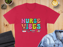 Load image into Gallery viewer, Red t-shirt with "Nurse Vibes" text and medical icons.