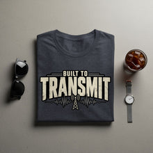 Load image into Gallery viewer, Dark t-shirt with "Built to Transmit" text, radio tower, and waveform graphic.