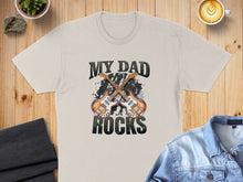 Load image into Gallery viewer, Cream t-shirt with "My Dad Rocks" and crossed electric guitars graphic.