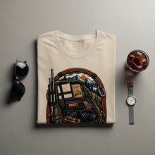 Load image into Gallery viewer, Cream t-shirt with graphic of open backpack and camping gear.