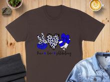 Load image into Gallery viewer, Brown t-shirt with peace, heart, and syringe graphic and "Peace love phlebotomy" text.