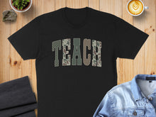 Load image into Gallery viewer, Black t-shirt with "TEACH" in camouflage letters.