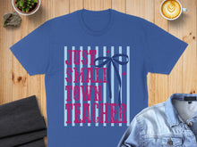 Load image into Gallery viewer, Blue t-shirt with "Just a small town teacher" in pink lettering and stripes.