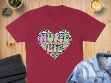 Load image into Gallery viewer, Burgundy t-shirt with "Nurse Life" text in a colorful, retro heart design.