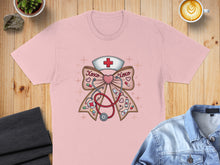 Load image into Gallery viewer, Pink t-shirt with stethoscope, nurse hat, and "XOXO" text.