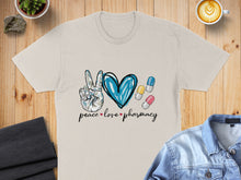 Load image into Gallery viewer, Peace sign, heart, and pills with "peace love pharmacy" text on a t-shirt.
