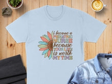 Load image into Gallery viewer, Light blue t-shirt with colorful flower graphic and text "I became a pediatric nurse because your life is worth my time".