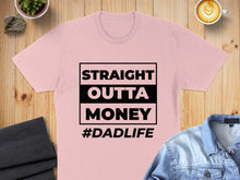 Load image into Gallery viewer, Pink t-shirt with "STRAIGHT OUTTA MONEY #DADLIFE" printed in black text.