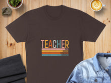 Load image into Gallery viewer, Brown t-shirt with "TEACHER" in colorful letters and motivational words.