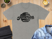 Load image into Gallery viewer, Grey t-shirt with "America Est. 1776" graphic and American flag circle.