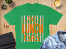 Load image into Gallery viewer, Green t-shirt with pink stripes and "Lunch Day" text.