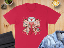 Load image into Gallery viewer, Red t-shirt with a pink bow featuring medical symbols like a stethoscope and cross.
