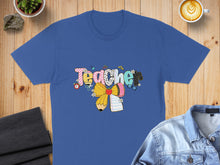 Load image into Gallery viewer, Blue t-shirt with "Teacher" text, a pencil, and floral designs.