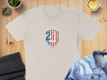 Load image into Gallery viewer, Light tan t-shirt with dripping 250 graphic featuring American flag elements and 1776-2026.