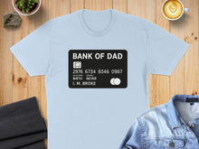 Load image into Gallery viewer, Light blue t-shirt with "Bank of Dad" credit card design.