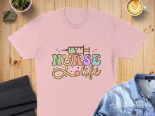 Load image into Gallery viewer, Pink t-shirt with "Nurse Life" text and syringe graphic.
