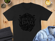 Load image into Gallery viewer, Black t-shirt with "Biker Dad" graphic featuring a motorcycle and wings.