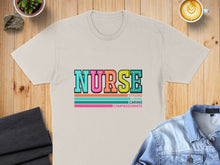 Load image into Gallery viewer, Cream t-shirt with "NURSE" in colorful letters and "Strong, Loyal, Caring, Compassionate" text.