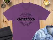 Load image into Gallery viewer, Purple t-shirt with "America Land of the Free Since 1776 Because of the Brave" text.