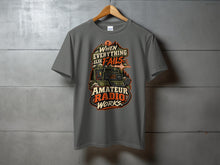 Load image into Gallery viewer, Grey t-shirt with "When Everything Else Fails, Amateur Radio Works" graphic.