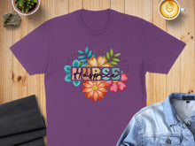 Load image into Gallery viewer, Purple t-shirt with "Nurse" text surrounded by colorful flowers and leaves.