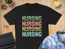 Load image into Gallery viewer, Black t-shirt with "NURSING" repeated in colorful leopard print text.