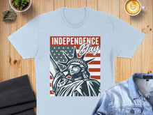 Load image into Gallery viewer, Light blue t-shirt with Statue of Liberty and American flag design.