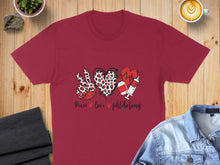 Load image into Gallery viewer, Burgundy t-shirt with peace sign, heart, and syringe with text "Peace love phlebotomy".