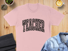 Load image into Gallery viewer, Pink t-shirt with "TEACHER" in a black and white checkered font.