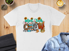Load image into Gallery viewer, White t-shirt with "MED TECH CREW" in leopard print and colorful letters, sunflowers, syringe, pills.