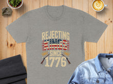 Load image into Gallery viewer, Gray t-shirt with "Rejecting Kings Since 1776" and American flag design.