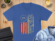 Load image into Gallery viewer, Blue t-shirt with distressed US flag and "We The People" text.