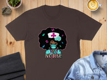 Load image into Gallery viewer, Brown t-shirt featuring a cartoon nurse with afro, stethoscope, and butterflies.