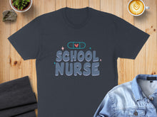 Load image into Gallery viewer, Dark t-shirt with "School Nurse" text and medical band-aid graphic.