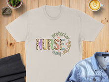 Load image into Gallery viewer, Cream t-shirt with "Nurse protector warrior hero" text in colorful leopard print letters.