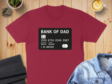 Load image into Gallery viewer, Burgundy t-shirt with "BANK OF DAD" credit card design and text.