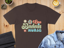 Load image into Gallery viewer, Brown t-shirt with "One Badass Nurse" text and floral accents.