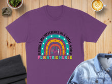 Load image into Gallery viewer, Purple t-shirt with rainbow and stethoscope graphic for pediatric nurses.