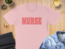 Load image into Gallery viewer, Pink t-shirt with "NURSE" text in distressed red lettering.