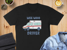Load image into Gallery viewer, Black t-shirt with a cartoon ambulance and "WEE WOO DRIVER" text.