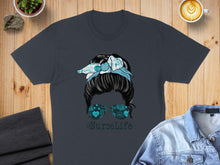 Load image into Gallery viewer, Nurse messy bun graphic on a t-shirt with medical symbols and "#NurseLife" text.