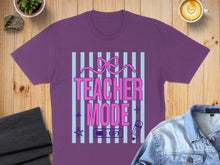 Load image into Gallery viewer, Purple t-shirt with "Teacher Mode: ON" text, pink bow, and pastel stripes.