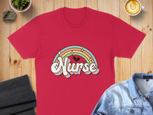 Load image into Gallery viewer, Red t-shirt with "Nurse" text and a pastel rainbow design.