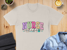 Load image into Gallery viewer, Beige t-shirt with "Nurse Life" text and medical icons.
