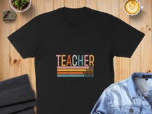 Load image into Gallery viewer, Black t-shirt with "TEACHER" in colorful vintage font and motivational words below.