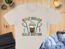 Load image into Gallery viewer, Shirt with "Half Nurse Half Coffee" design and stethoscope.