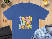 Load image into Gallery viewer, Blue t-shirt with "Teach Love Inspire" text in colorful, retro lettering.