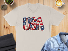 Load image into Gallery viewer, Cream t-shirt with distressed "USA" graphic featuring American flag pattern.
